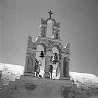 Santorini 1955. Children ringing church bells for a funeral.