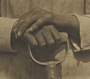 Hands Resting on Tool